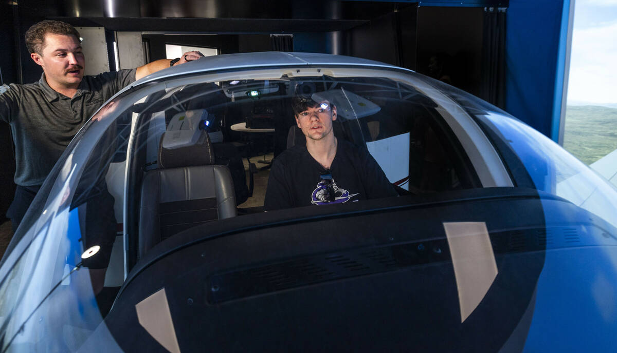 Flight instructor Phil Starcher, top, works with aspiring pilot Jake Harper as he takes a fligh ...