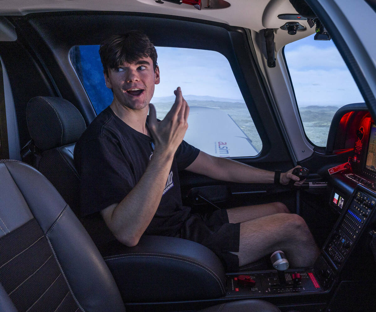 Aspiring pilot Jake Harper talks with an instructor as he takes a flight demo in a state-of-the ...