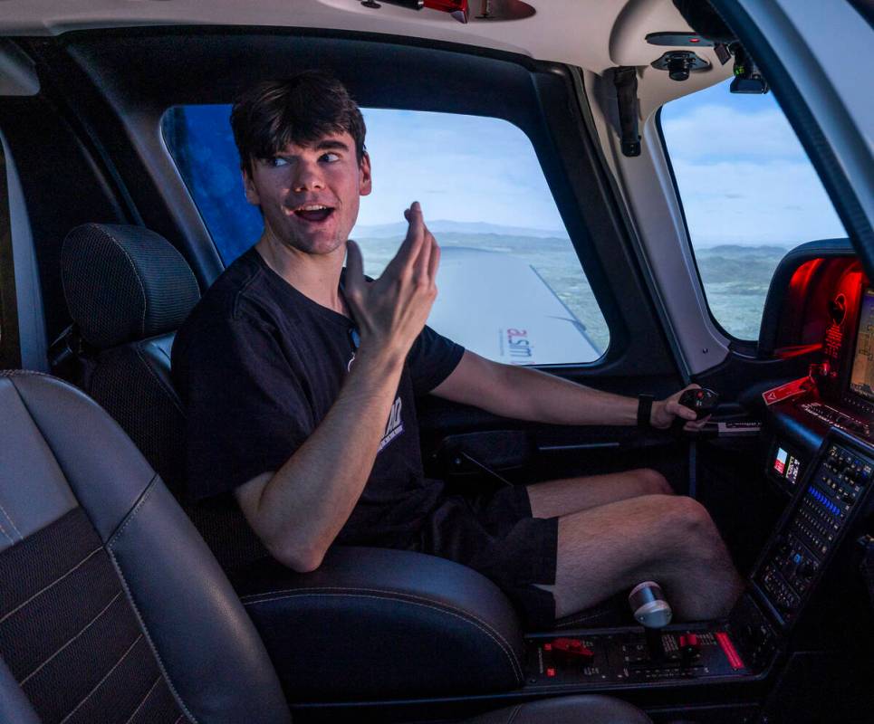 Aspiring pilot Jake Harper talks with an instructor as he takes a flight demo in a state-of-the ...