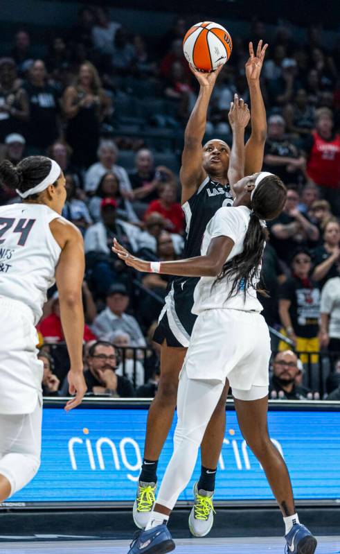 Aces guard Jackie Young (0) gets off a shot over an Atlanta Dream defender during the first hal ...