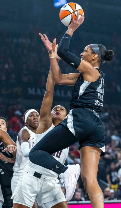 Aces center A'ja Wilson (22) elevates to shoot over Atlanta Dream forward Naz Hillman (00) duri ...