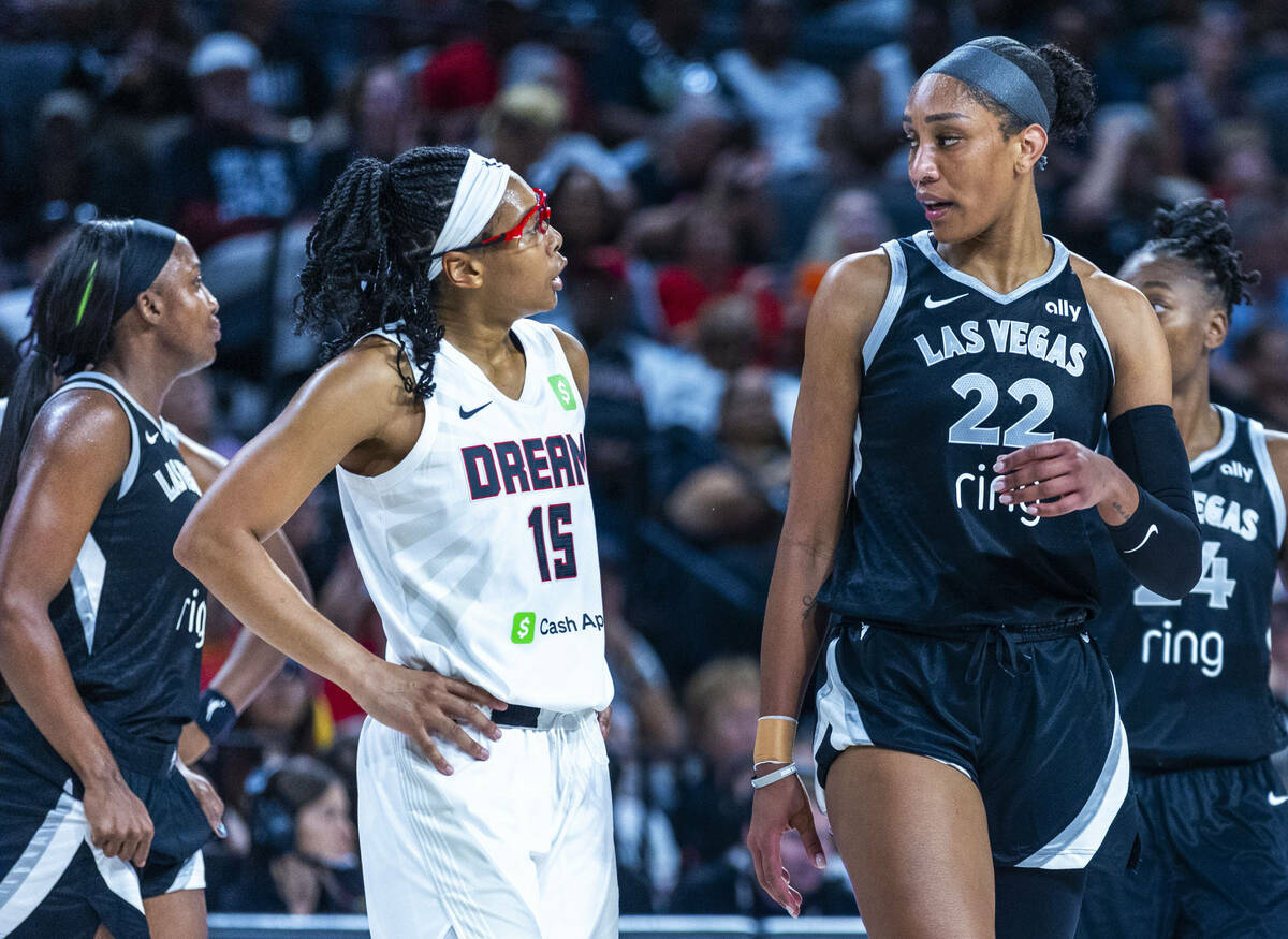 Atlanta Dream guard Allisha Gray (15) has a small disagreement with Aces center A'ja Wilson (22 ...