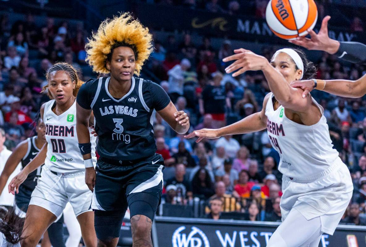 Aces forward NaLyssa Smith (3) looks to a loose ball with Atlanta Dream forward Brionna Jones ( ...