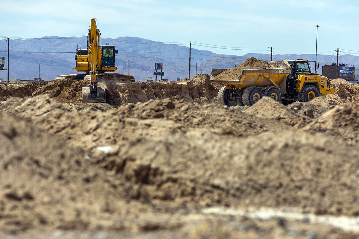 Soil is scraped and hauled as grading work continues on Brightline West's land on Wednesday, Au ...