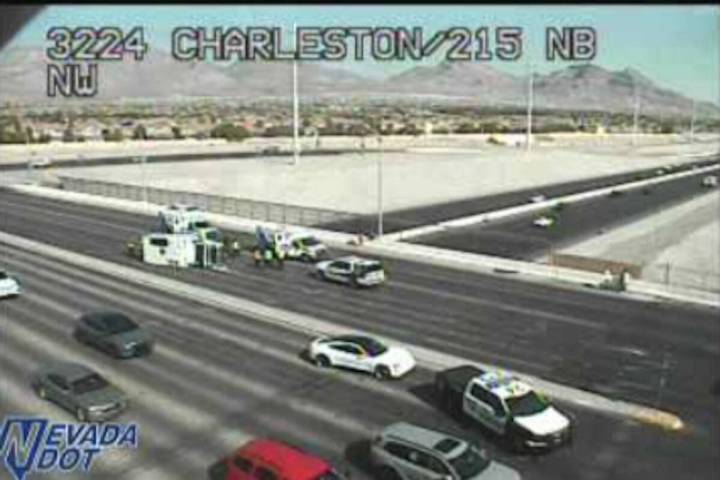A busy west Las Vegas Valley intersection saw delays Wednesday morning after an ambulance rolle ...