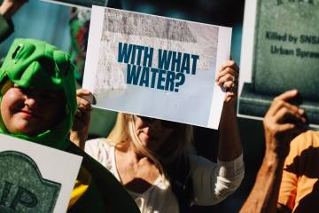 Environmental activists protest during a news conference about the Southern Nevada Supplemental ...