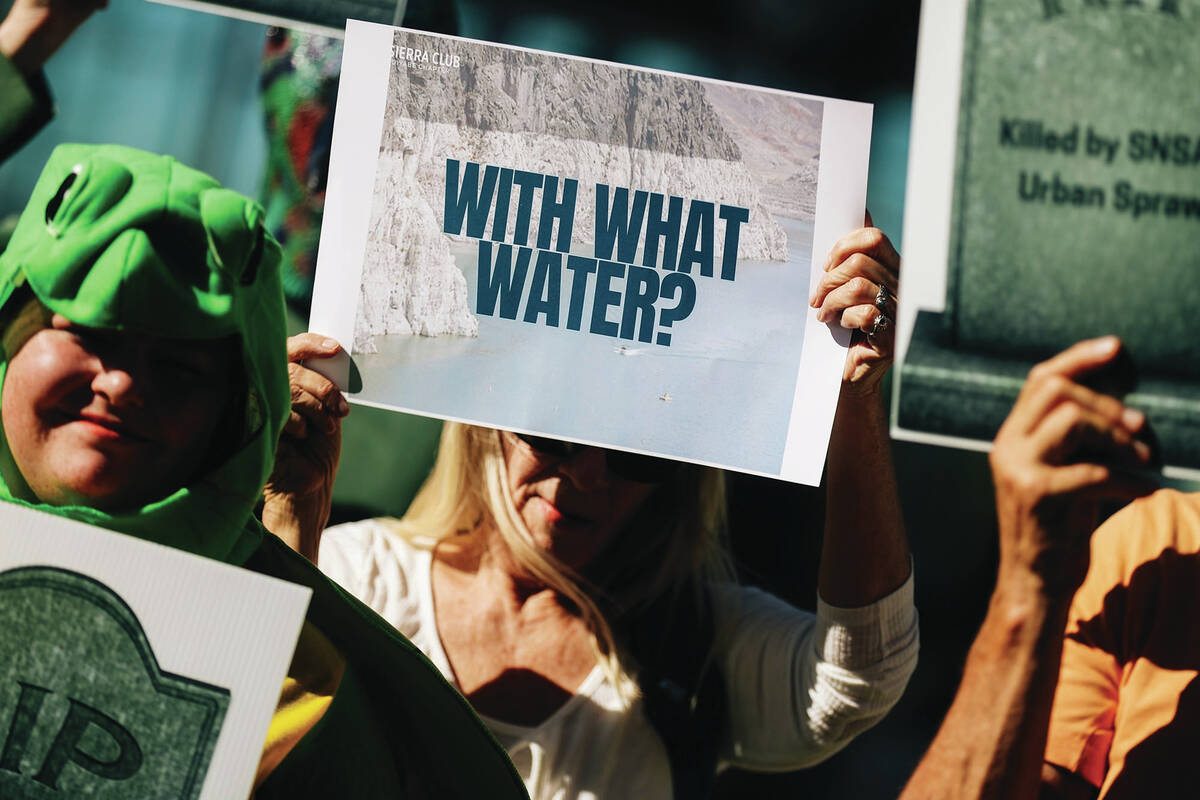 Environmental activists protest during a press conference about the Southern Nevada Supplementa ...