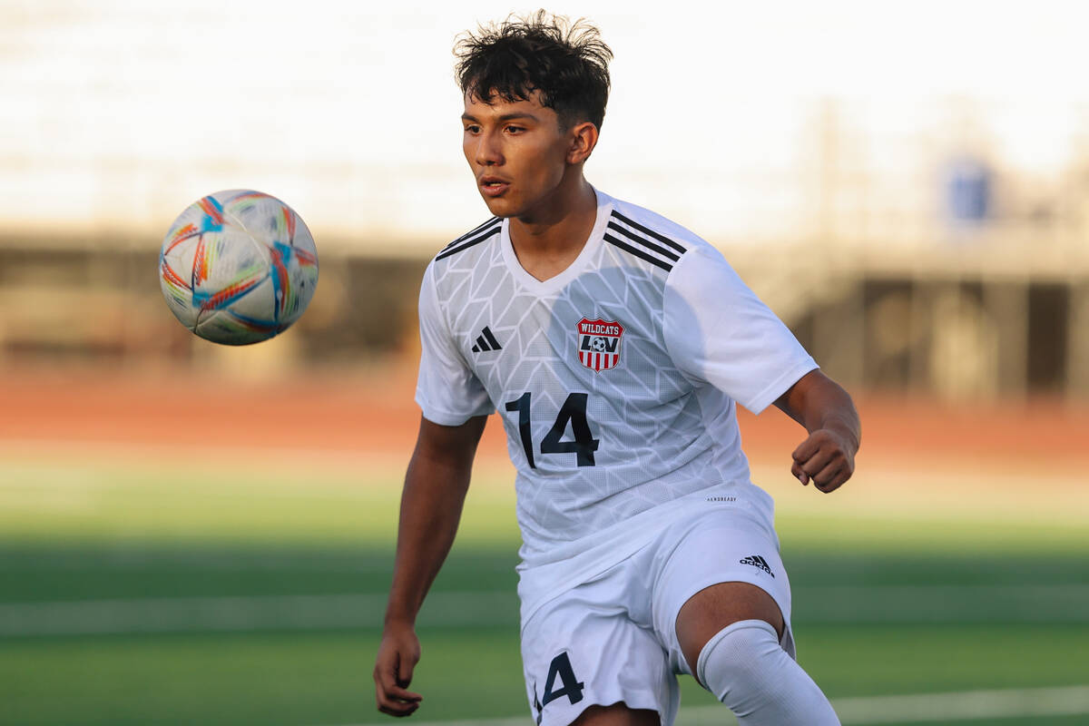 Las Vegas’ Cesar Ruelas eyes the ball during a high school boys soccer game between West ...