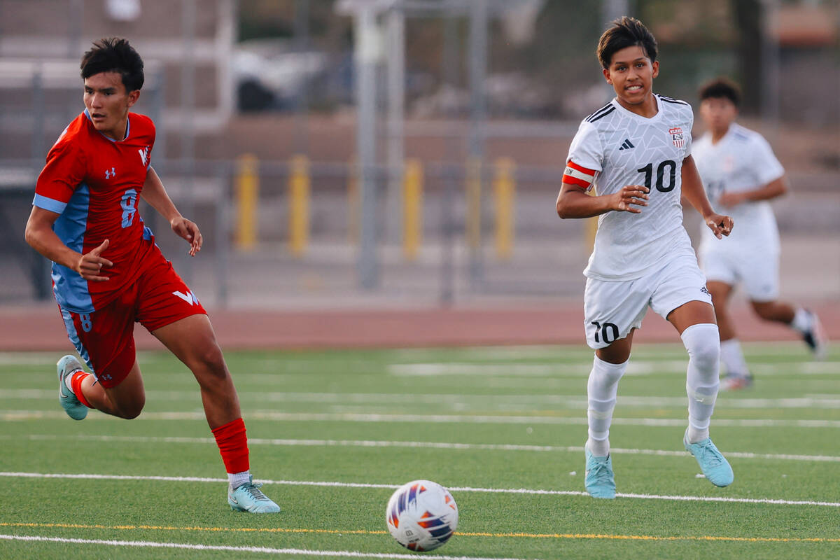 Las Vegas striker Anthony Cardenas (10) and Western midfielder Ethan Romo (8) chase the ball du ...