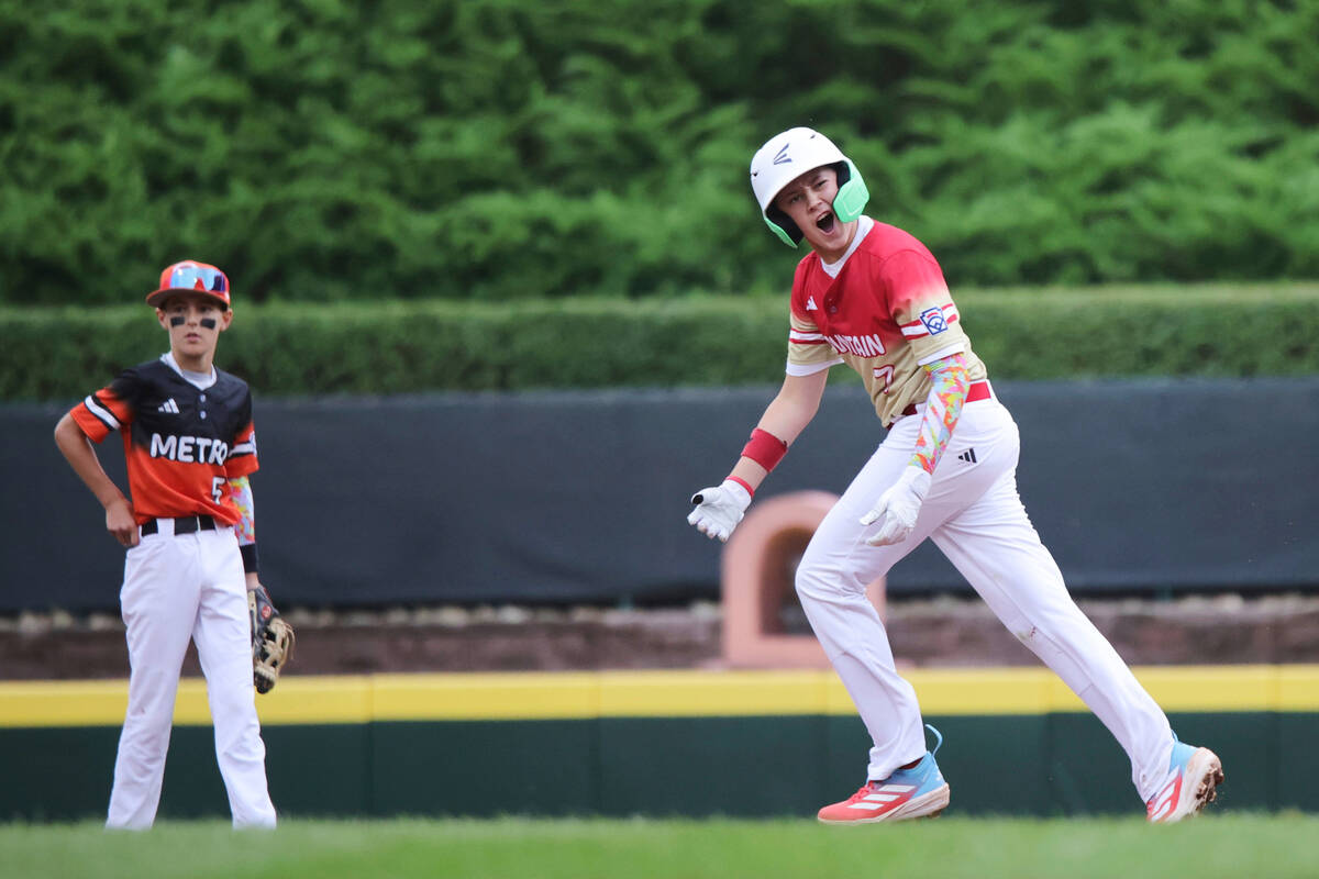 Las Vegas, Nev.'s Cache Malan celebrates his three-run home run against Fairfield, Conn., durin ...