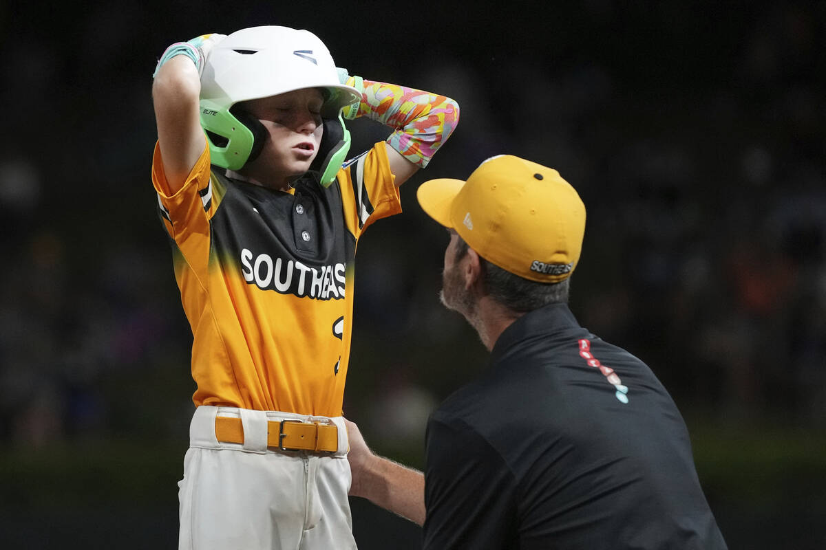 Irmo, S.C.'s Preston Ware, left and David Bogan, right react during the sixth inning of a baseb ...