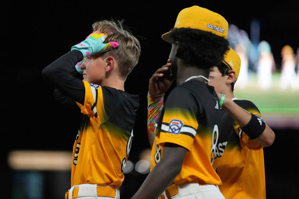 Irmo, S.C.'s Brady Westbrooks, left, reacts following a baseball game against Las Vegas, Nev., ...