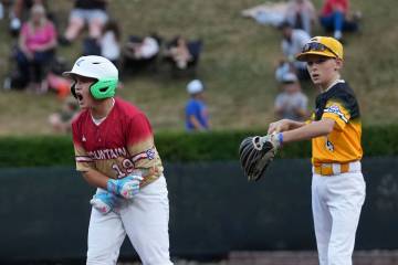 Las Vegas, Nev.'s Garrett Gallegos, left, celebrates after a hit during the first inning of a b ...