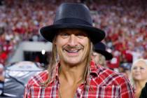 Musician Kid Rock is seen on the sidelines during the third quarter of an NCAA football game be ...