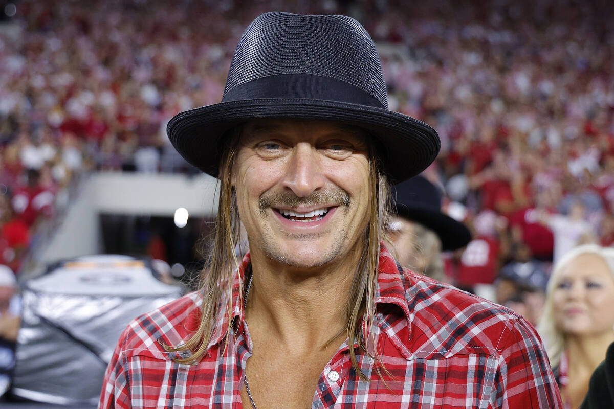 Musician Kid Rock is seen on the sidelines during the third quarter of an NCAA football game be ...
