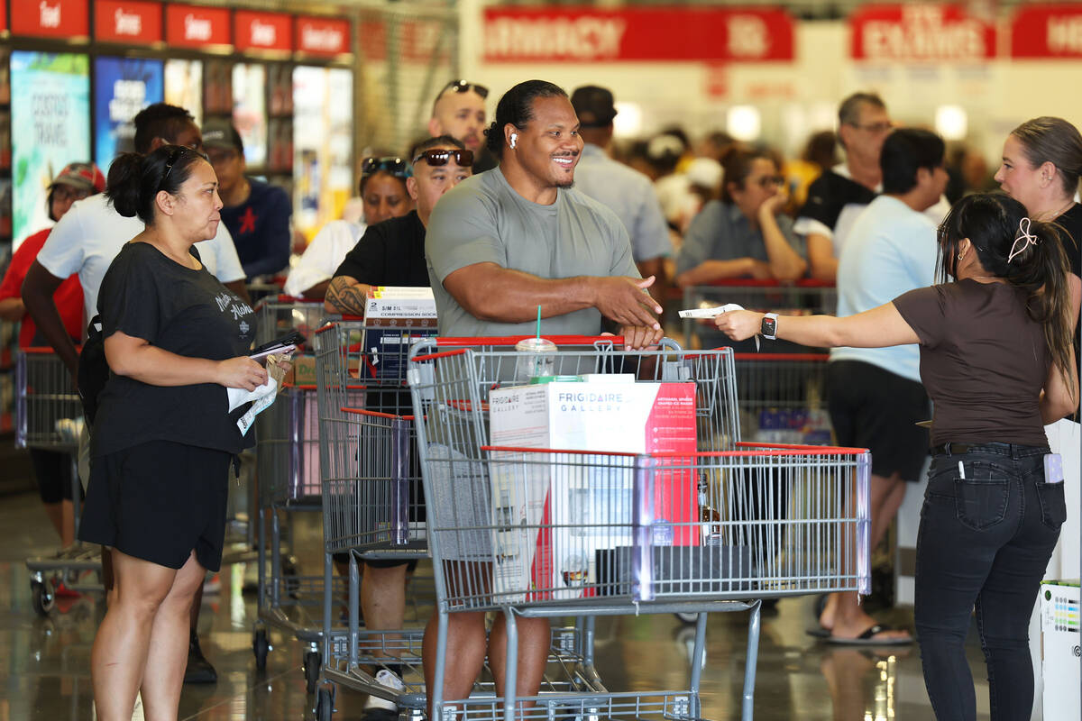 Shoppers exit the newly opened Costco at 6880 S. Buffalo Drive on Thursday, Aug. 21, 2025, in L ...