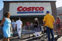 People wait in line to enter the newly opened Costco at 6880 S. Buffalo Drive on Thursday, Aug. ...