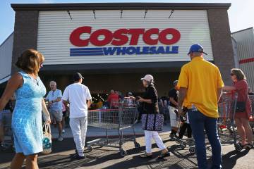 People wait in line to enter the newly opened Costco at 6880 S. Buffalo Drive on Thursday, Aug. ...
