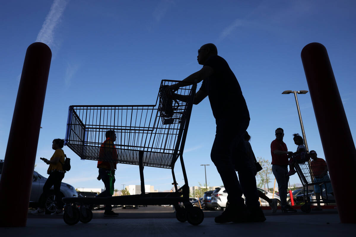 People wait in line to enter the newly opened Costco at 6880 S. Buffalo Drive on Thursday, Aug. ...