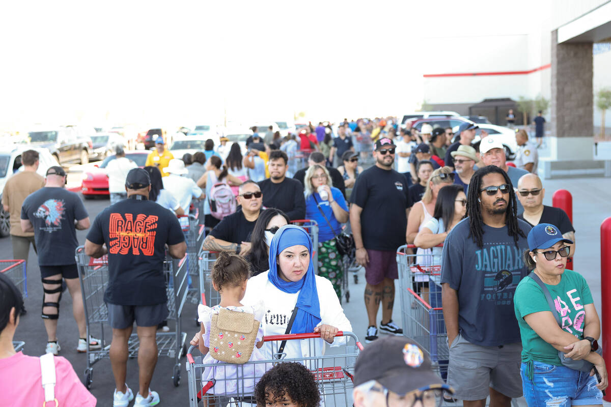 People wait in line to enter the newly opened Costco at 6880 S. Buffalo Drive on Thursday, Aug. ...