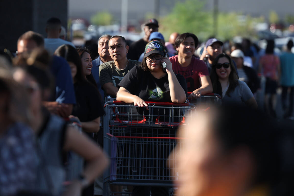 People wait in line to enter the newly opened Costco at 6880 S. Buffalo Drive on Thursday, Aug. ...