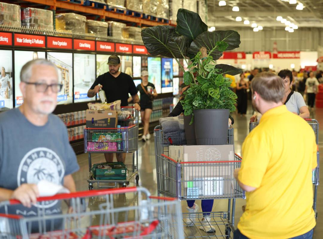 Shoppers exit the newly opened Costco at 6880 S. Buffalo Drive on Thursday, Aug. 21, 2025, in L ...