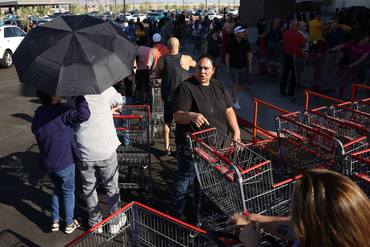People wait in line to enter the newly opened Costco at 6880 S. Buffalo Drive on Thursday, Aug. ...