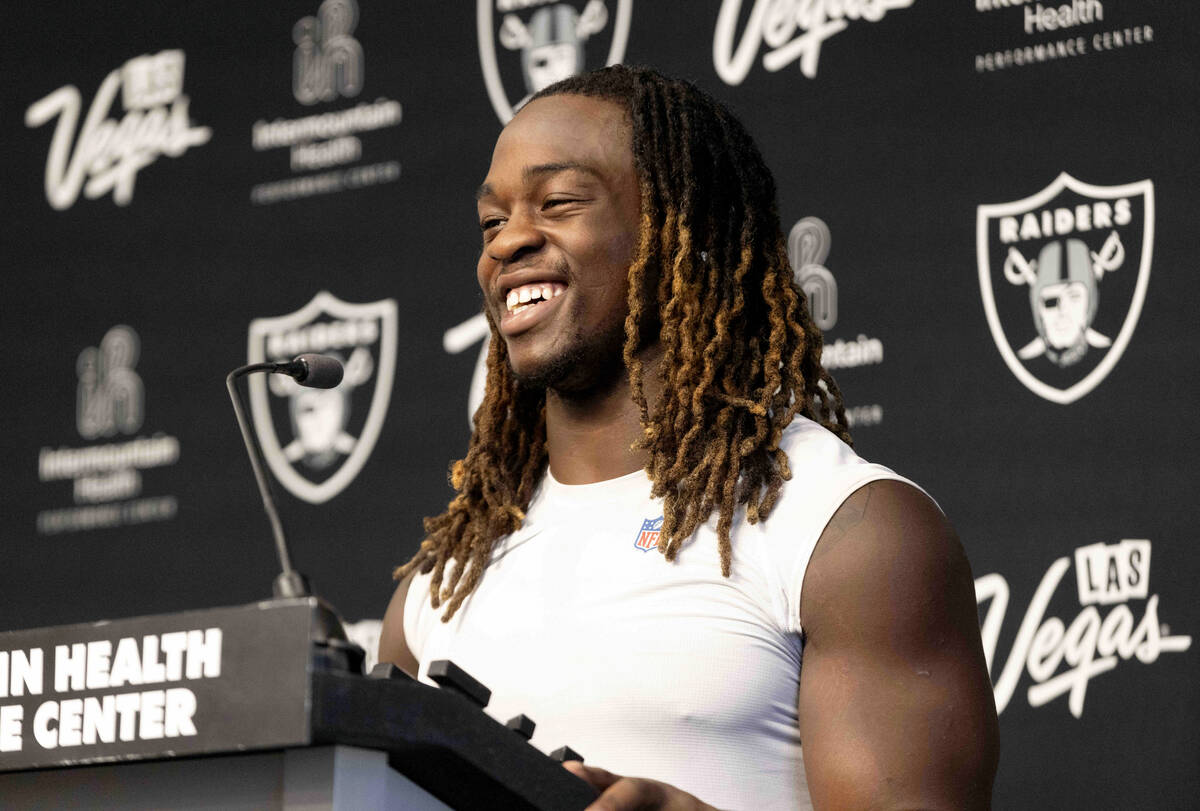 Raiders running back Ashton Jeanty reacts to a question from the media during a news conference ...