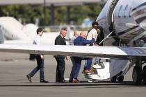Harjinder Singh is escorted onto an airplane by Florida Lt. Gov. Jay Collins and law enforcemen ...