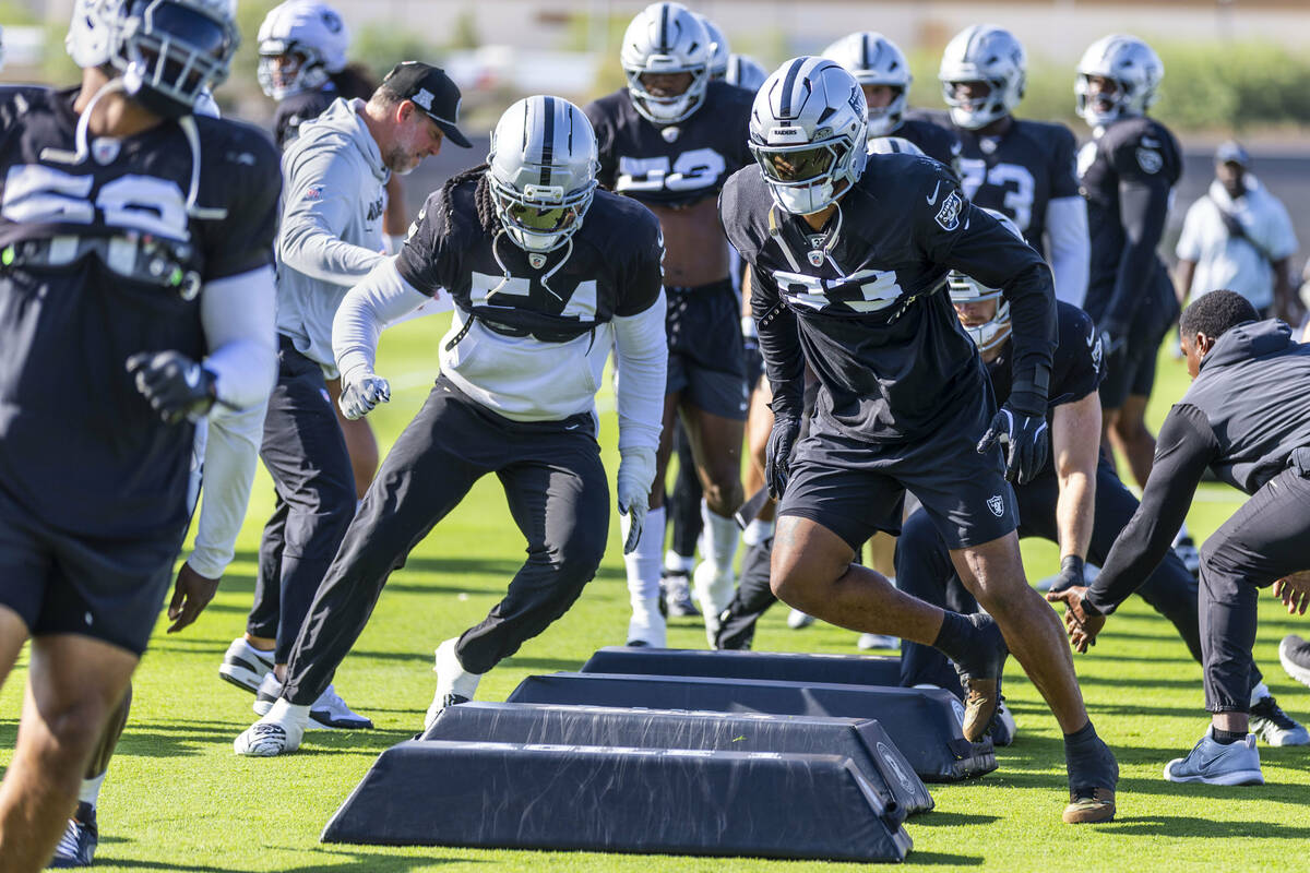 Raiders safety Jamal Adams (33) leads a drill with teammates during a drill at the Intermountai ...