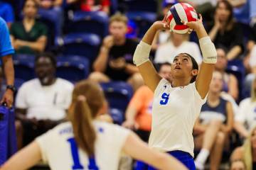 Bishop Gorman setter Trinity Thompson (9) hits the ball during a high school girls volleyball g ...