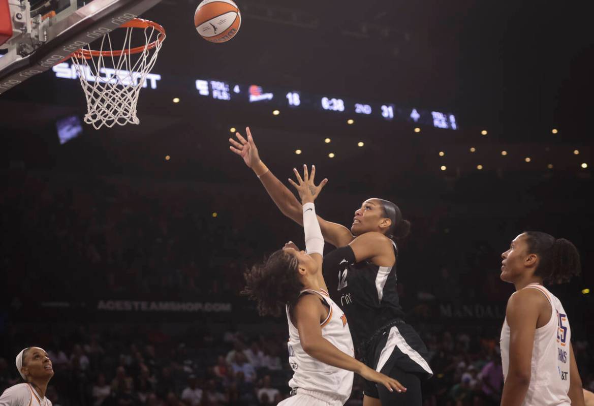 Aces center A'ja Wilson (22) shoots over Phoenix Mercury forward Satou Sabally (0) during the f ...