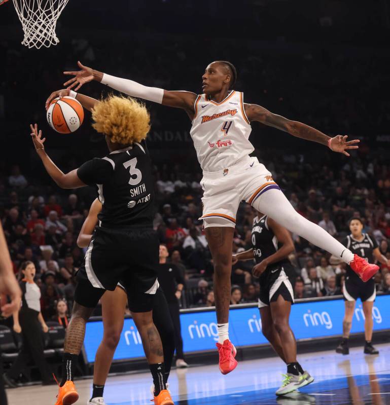 Aces forward NaLyssa Smith (3) grabs a rebound against Phoenix Mercury forward Natasha Mack (4) ...