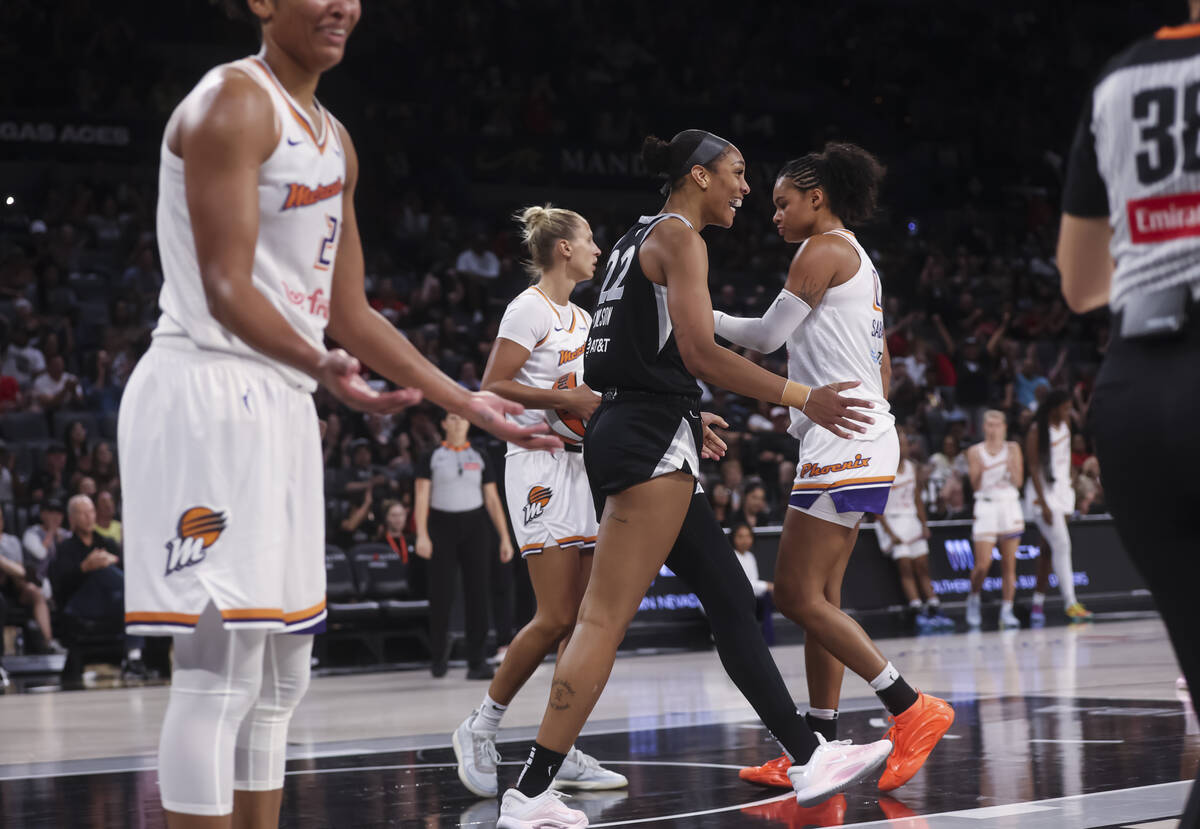 Aces center A'ja Wilson (22) reacts after getting fouled by Phoenix Mercury forward Alyssa Thom ...