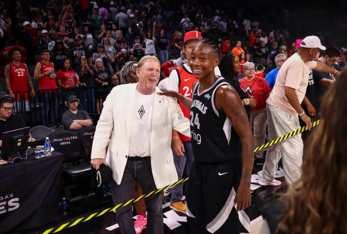 Aces owner Mark Davis greets Aces guard Jewell Loyd after the team’s defeat over the Pho ...