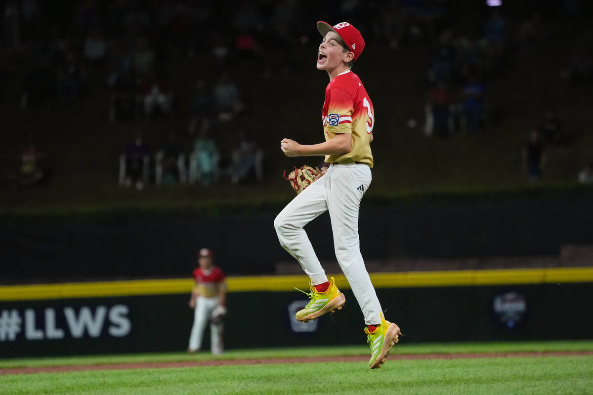 Las Vegas, Nev.'s Luke D'Ambrosio celebrates following a baseball game against Irmo, S.C., ...