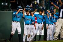 Las Vegas lifts its hats before departing the field following the U.S. Championship Game of the ...