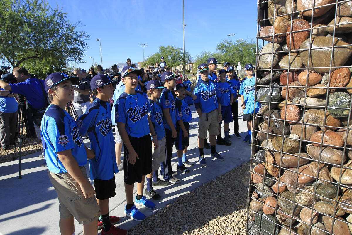 Mountain Ridge Little Leauge teammates examine a monument dedicated to them in Mountain Ridge P ...