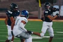 Foothill wide receiver Braxton Bonnett (15) keeps the ball away from Green Valley linebacker Ga ...