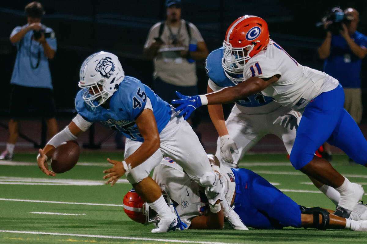 Centennial running back Kolten Silbernagel (45) leaps after a loose ball during the football ga ...