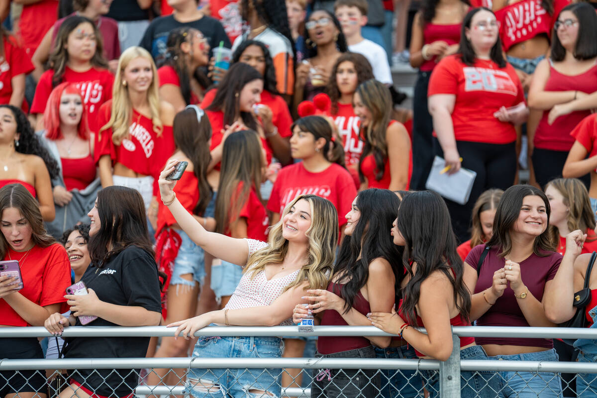 Students take a selfie in the stands at a football game between Mililani and Arbor View at Arbo ...