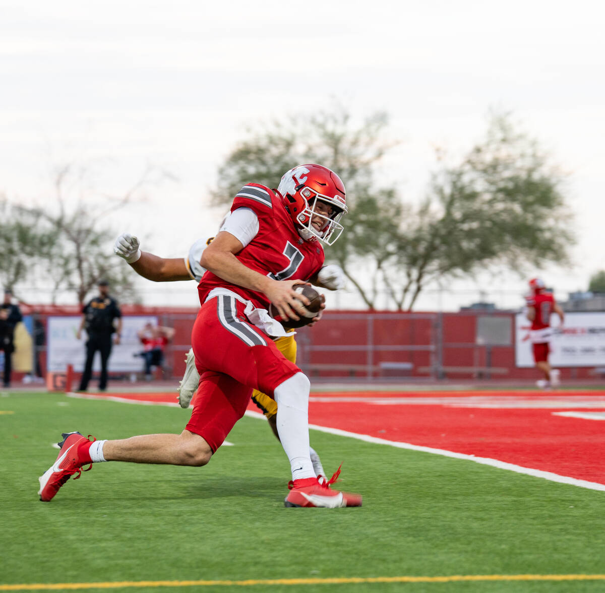 Arbor View Quarterback Thaddeus Thatcher (7) approaches the end zone during a football game bet ...