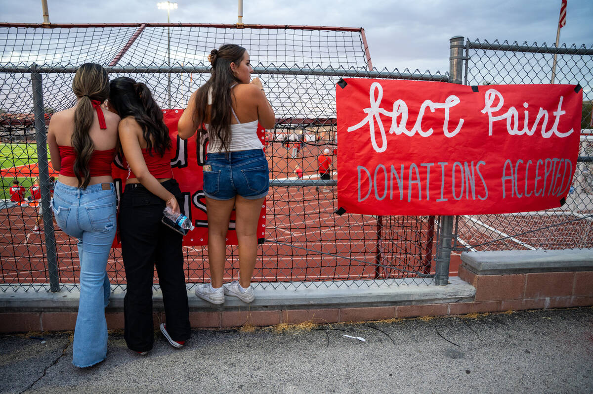 Students wait for the second half of a football game between Mililani and Arbor View to start a ...