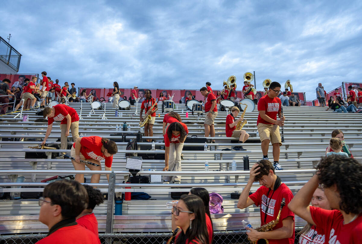 The Arbor View marching band retakes their places for the second half of a football game betwee ...