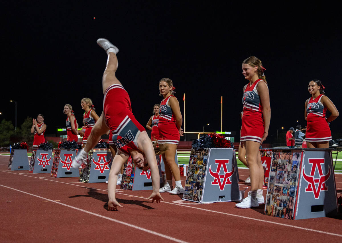 The Arbor View cheerleaders perform in front of their student section during a football game be ...