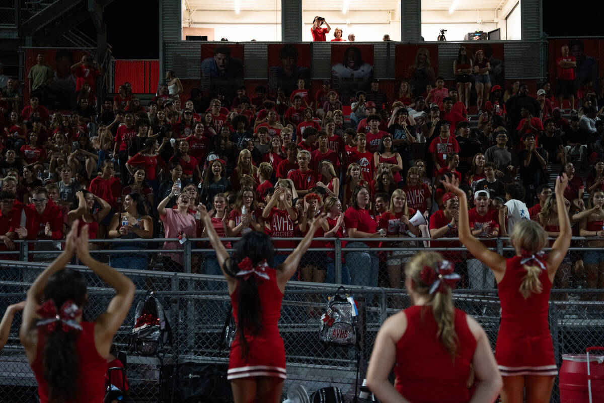 The Arbor View cheerleaders perform in front of their student section during a football game be ...