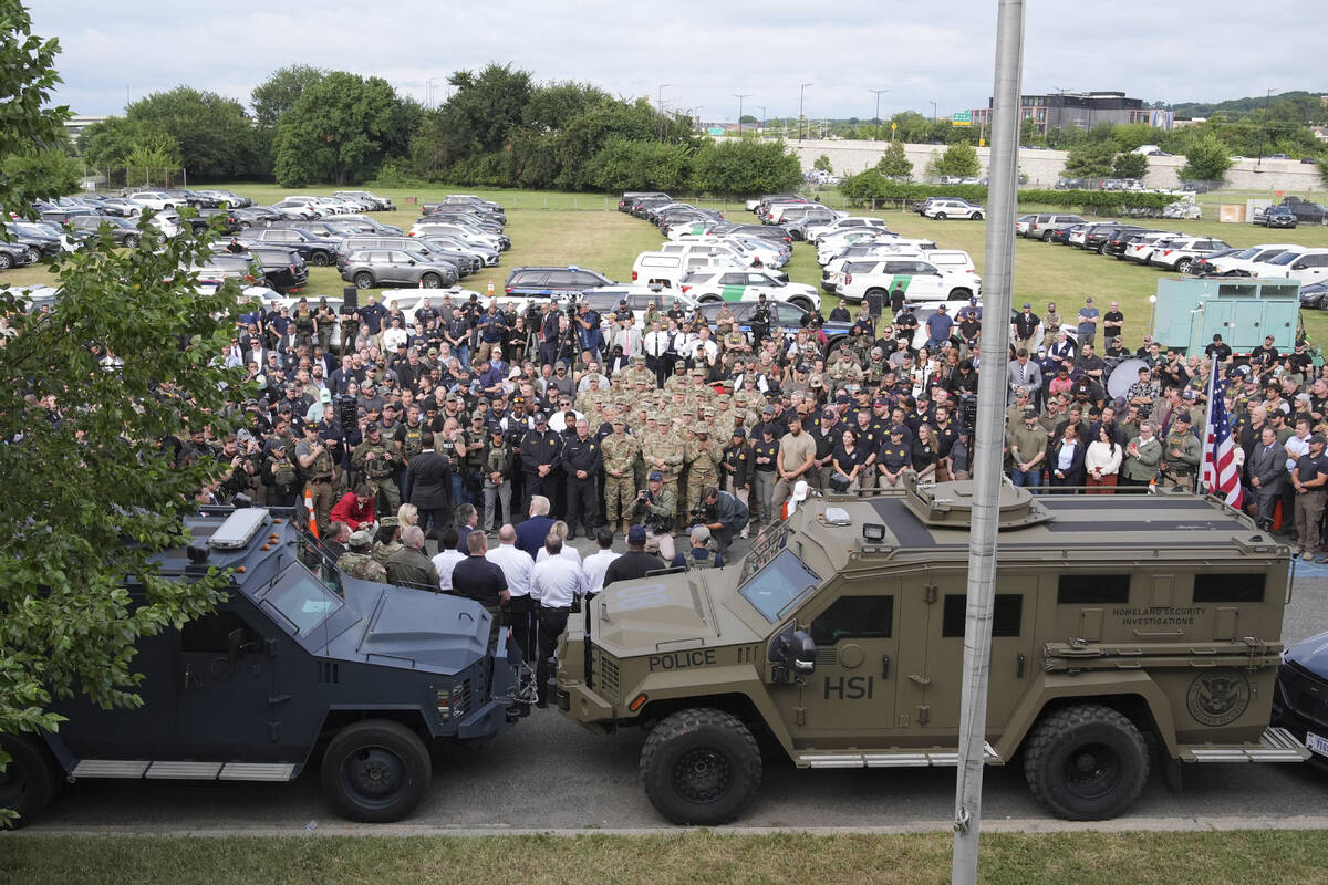 President Donald Trump speaks with members of law enforcement and National Guard soldiers, Thur ...