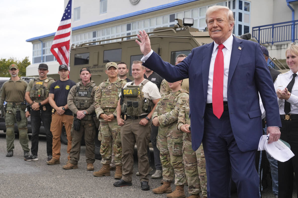 President Donald Trump speaks with members of law enforcement and National Guard soldiers, Thur ...