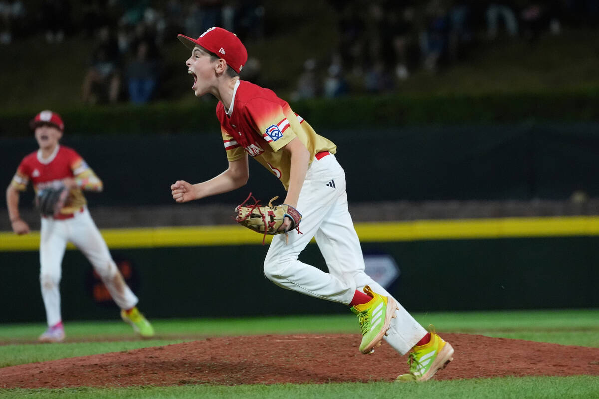 Las Vegas, Nev.'s Luke D'Ambrosio, right, celebrates following a baseball game against Irm ...