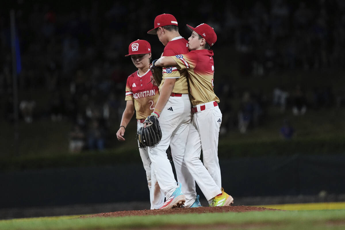 Las Vegas' Ethan Robertson, left, Cache Malan, center, and Luke D'Ambrosio react during the fif ...